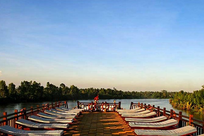 3-day Mekong Eyes Cruise Vietnam - Cambodia - Day 1 Cai Be/Can Tho: orchards, villages, and sunset from the top deck