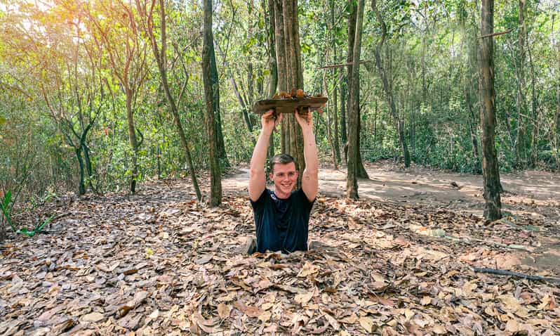From HCM: Cost-Saving CuChi Tunnel & Mekong Delta 1-Day Tour - Cu Chi: from propaganda film to secret entrance tunnel crawls