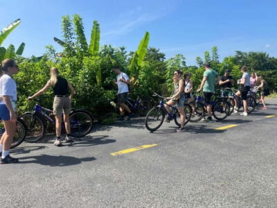 From Ho Chi Minh: Cai Be Boat & Bike Mekong Delta Experience - Tien River Break: Photos, Snacks, and a Quick Taste of Culture