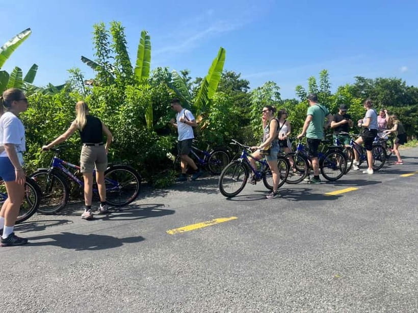 From Ho Chi Minh: Cai Be Boat & Bike Mekong Delta Experience - Tien River Break: Photos, Snacks, and a Quick Taste of Culture