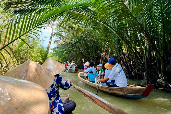 Full Day Guided Mekong Delta Day Tour in Vietnam (Multilingual) - My Tho canal time: wooden boats, local village life, and floating-market energy