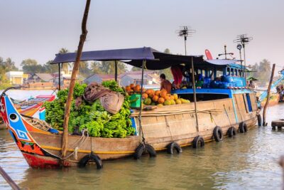 Full-Day Mekong Delta Tour - Rowing into quiet canals after the market