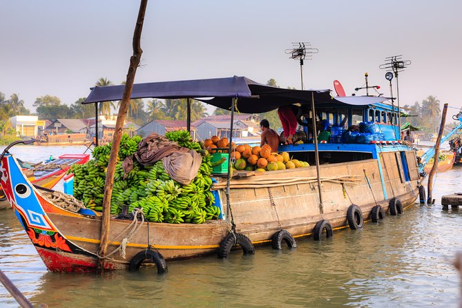 Full-Day Mekong Delta Tour - Rowing into quiet canals after the market