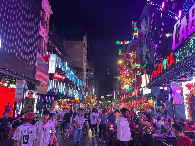 Ho Chi Minh City: Night Walking Tour with Hidden Gem Stop - Nguyễn Huệ Walking Street: city lights, big sights, and photo angles