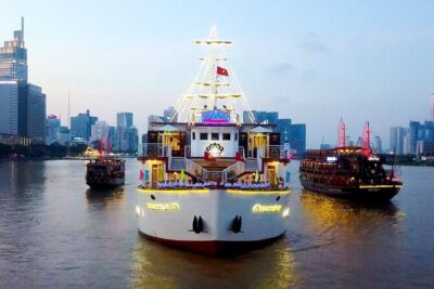 Indochina Queen Dinner Cruise on Saigon River - Saigon after dark from the water: skyline lights and river time