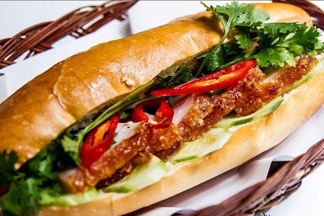 Morning Walking Food Tour in Non Tourist Area and Full of Local Life - Tasting walk: banh mi heo quay, banh khot, and more snacks