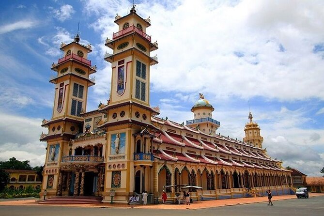 Private Tour: Cu Chi Tunnels and Cao Dai Temple - Cao Dai Temple at midday: watching a faith built from many sources