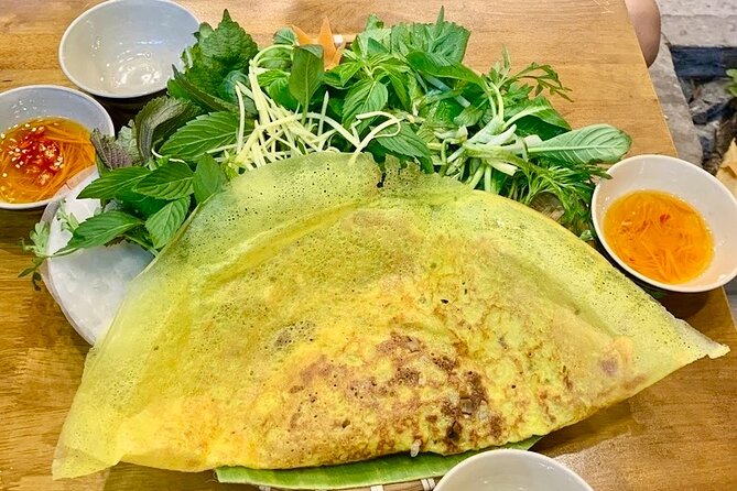 Saigon By Night: Authentic Street Food Scooter Adventure - Meeting in District 1 and Getting Ready for Saigon After Dark