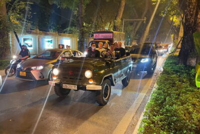 Saigon By Night Open Air Jeep Street Food Tour Experience - Vinh Khanh Street street food: Banh Xeo, Nem Lui, and coconut ice cream