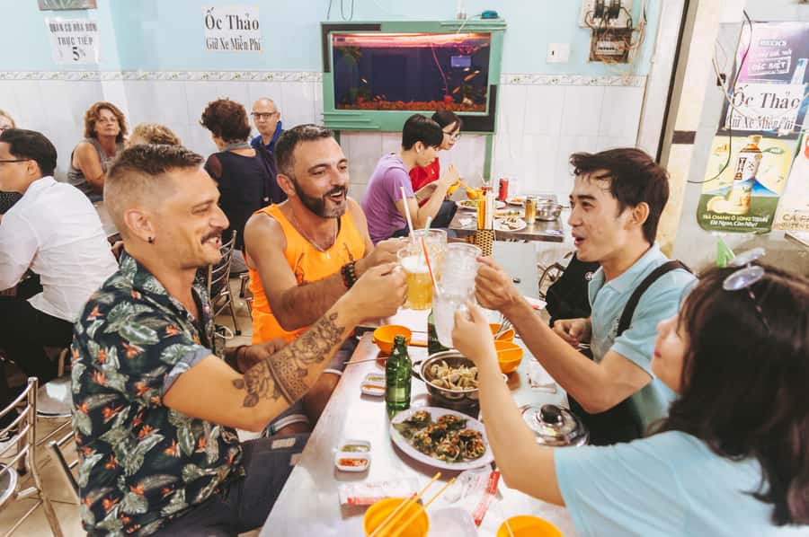 Saigon: Private Backstreets Walking Food Tour - District 10 finale: Bánh Mì, flan or black bean dessert, and iced drinks