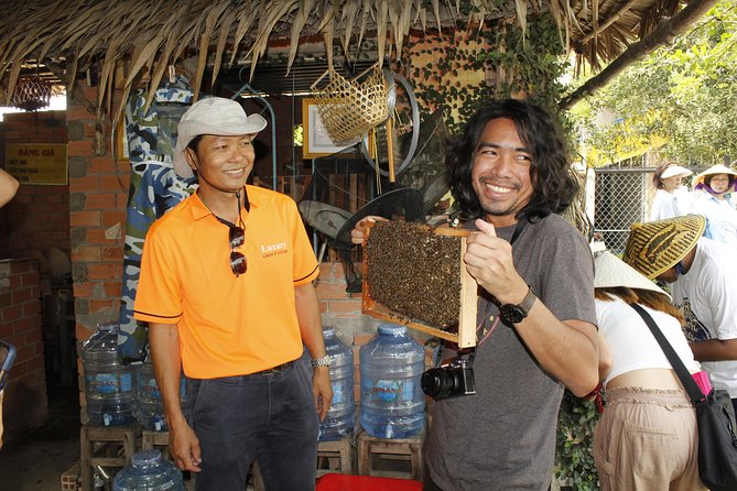 Shared Cu Chi Tunnels & Mekong Delta Tour Full Day - Fruit, honey tea, honey wine, and folk music